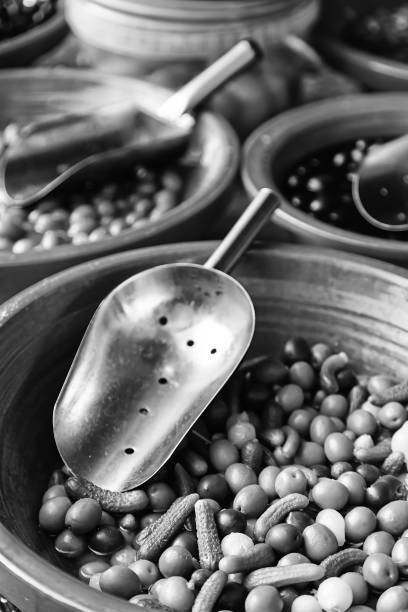 Olives in a traditional market, detail of olives preserved in oil