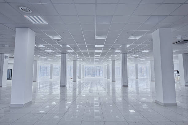 istock Spotlight and empty space. Empty office space in modern building. Interior of empty unfinished modern market. Architecture concept. Empty white room has white walls. Shopping center 1326769397