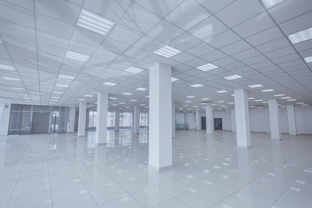 istock Spotlight and empty space. Empty office space in modern building. Interior of empty unfinished modern market. Architecture concept. Empty white room has white walls. Shopping center 1326769413