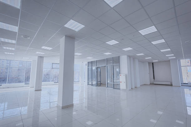 istock Spotlight and empty space. Empty office space in modern building. Interior of empty unfinished modern market. Architecture concept. Empty white room has white walls. Shopping center 1326769421