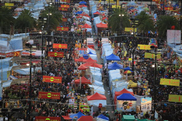 Hong Kong, January  29 2014 :festival crowd in CNY flower market in victoria park in hong kong on 29 Jan. 2014. Victoria park is the biggest flower market during the chinese new year.