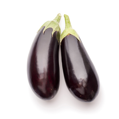 Two eggplants photographed on white background