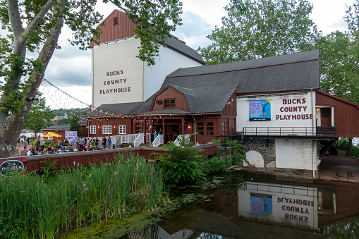 New Hope, USA - June 26, 2021. People gathering at a party in the front yard of Bucks County Playhouse, New Hope, Pennsylvania, USA