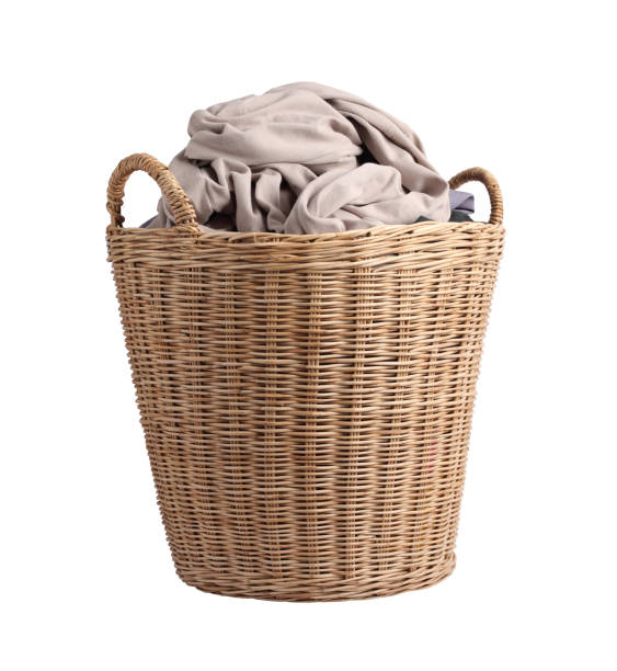 Basket with dirty laundry isolated on white background stock photo