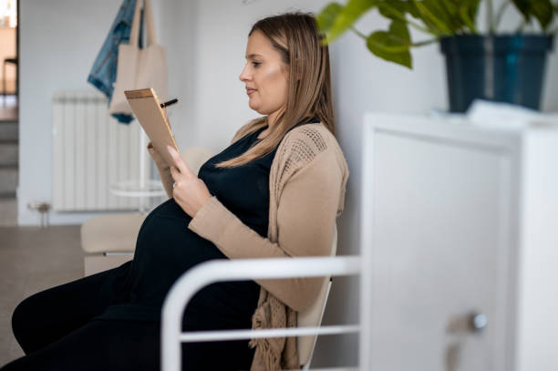 istock Woman filling up a documents at doctor office 1326778685