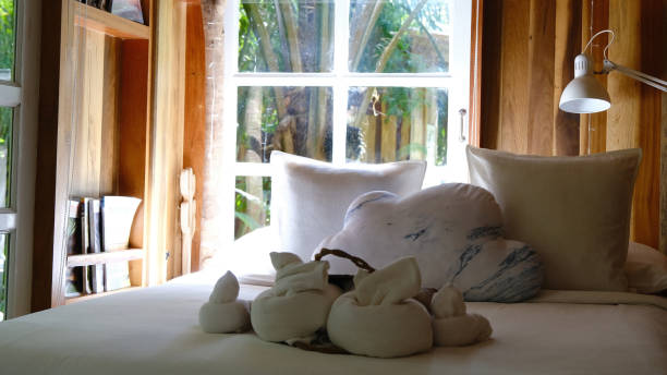 Rustic interior of log cabin bedroom Rustic interior of log cabin bedroom, cozy wooden minimal room decor. modern cottage interior design stock pictures, royalty-free photos & images