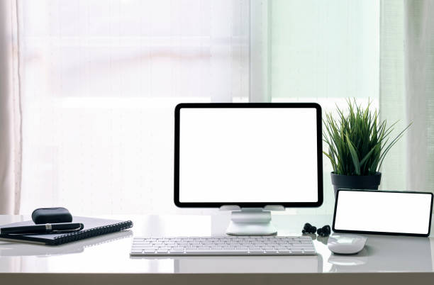 istock Home office setup with tablet and smartphone on the table. 1326781186