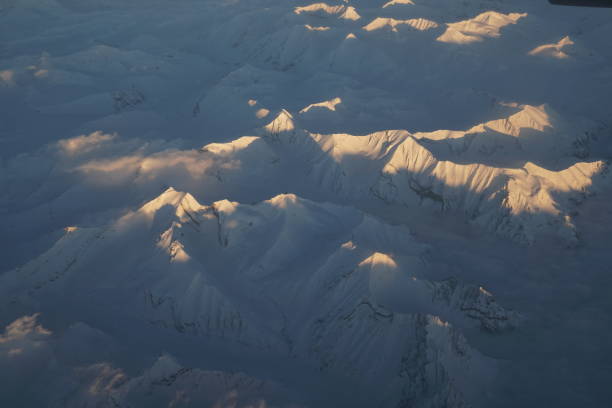 Nature scene - Aerial view of Snow Mountain and light of sunrise on the top  himalaya mountains from the plane at Leh Ladakh , Jammu and Kashmir , India - beautiful scene Nature scene - Aerial view of Snow Mountain and light of sunrise on the top  himalaya mountains from the plane at Leh Ladakh , Jammu and Kashmir , India - beautiful scene stok kangri stock pictures, royalty-free photos & images