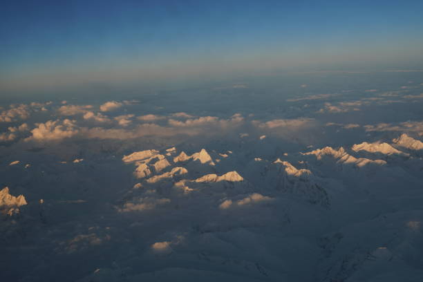 Nature scene - Aerial view of Snow Mountain and light of sunrise on the top  himalaya mountains from the plane at Leh Ladakh , Jammu and Kashmir , India - beautiful scene Nature scene - Aerial view of Snow Mountain and light of sunrise on the top  himalaya mountains from the plane at Leh Ladakh , Jammu and Kashmir , India - beautiful scene stok kangri stock pictures, royalty-free photos & images