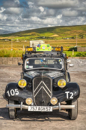 Portmagee, Ireland, Aug 2019 Vintage Citroen Traction Avant from 1950s, converted to taxi, tourist attraction. Parked at Kerry Cliffs, Ring of Kerry