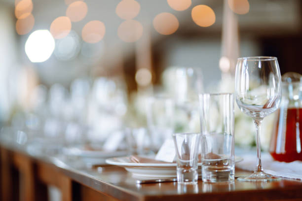 istock Beautiful table setting for a party, wedding reception or other festive event. Banquet setting, glasses, plates. 1326783170