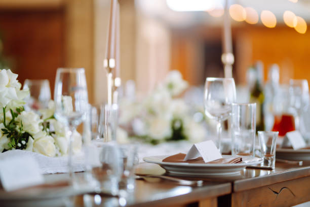 istock Beautiful table setting for a party, wedding reception or other festive event. Banquet setting, glasses, plates. 1326783277