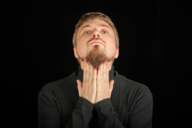 istock Cute bearded man, threw head back, black background 1326783318