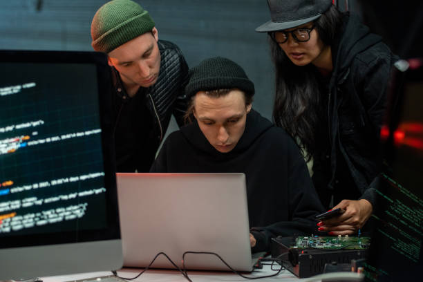 istock Group of information criminals entering system 1326785939