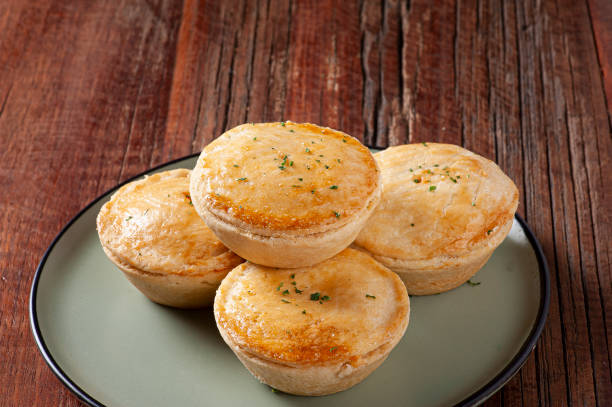 Typical Brazilian cuisine appetizer called Empada de Camarão Typical Brazilian cuisine appetizer called Empada de Camarão. Copy space meat pie stock pictures, royalty-free photos & images