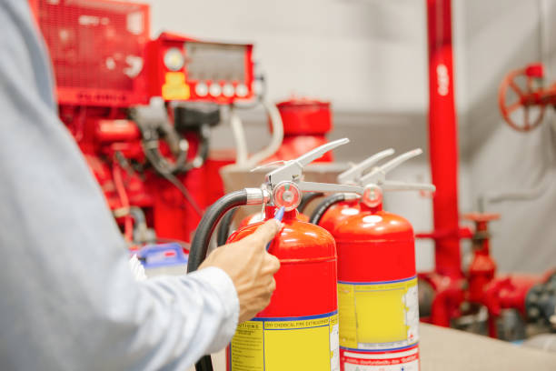 istock Engineer inspection Fire extinguisher and fire hose,Ready to use in the event of a fire.Safety first concept. 1326790606