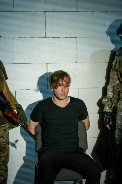 istock Young criminal giving confession about network crime 1326792782
