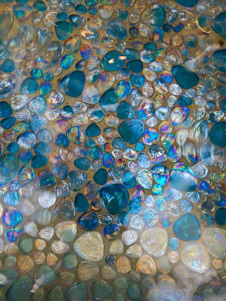 istock Pearlescent stones with blue and green underwater. 1326797698