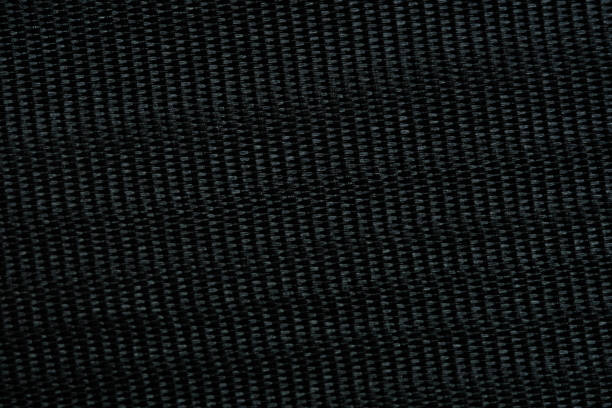 istock Black color of silk fabric texture background. 1326798327