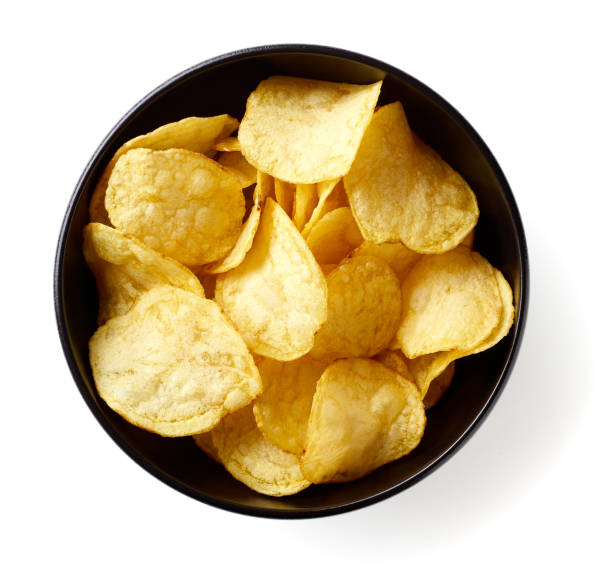 istock Potato chips isolated on white background, from above 1326799462