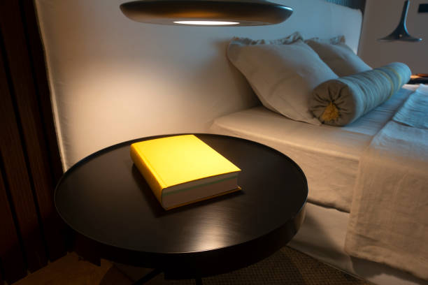 istock Close up shot of nightstand with a book 1326800624