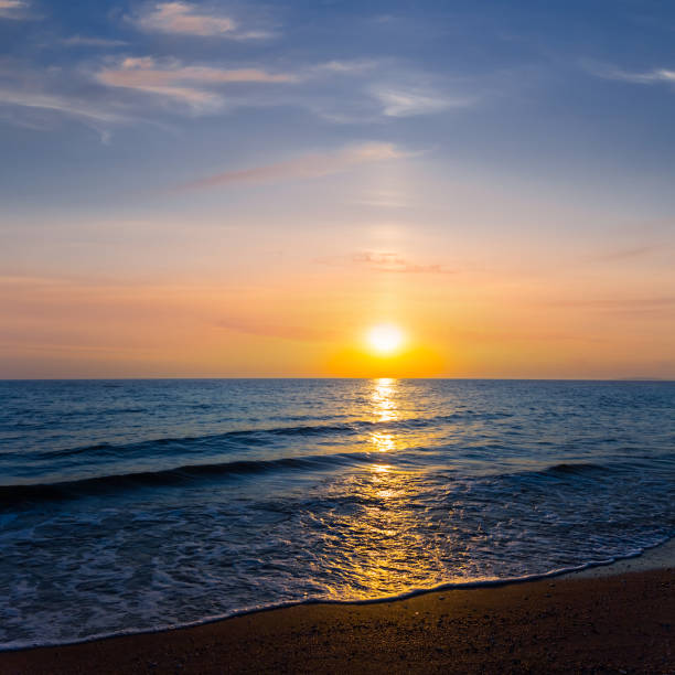istock sandy emerald sea beach at the dramatic sunset, summer sea vacation background 1326800839