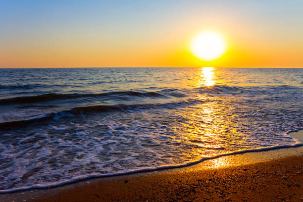 istock sandy emerald sea beach at the dramatic sunset, summer sea vacation background 1326800907