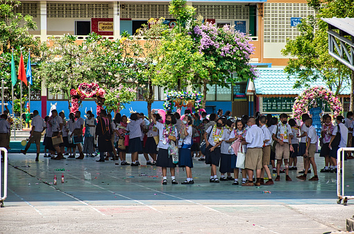 Bangkok, Thailand 04.07.2021 Thai children on a break on the courtyard of Watpakbor School