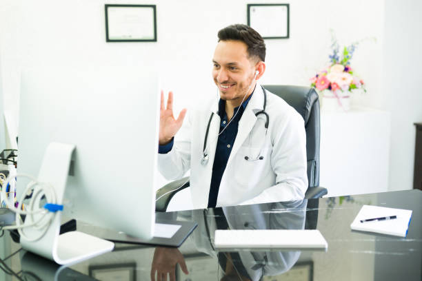 istock Happy specialist saying hello to a patient 1326804266