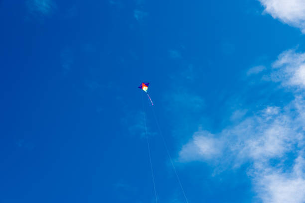 istock Colorful Kites flying over the sky 1326805680