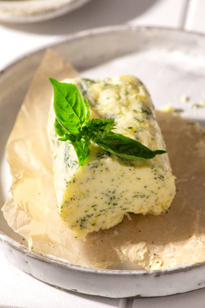 istock Hand made butter on a white plate. Close view. 1326810854