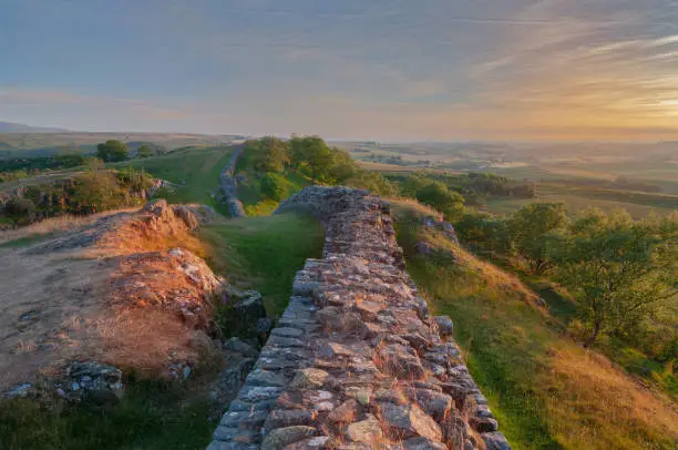 Sun setting on Hadrian's wall at  Walltown crags in Northumberland