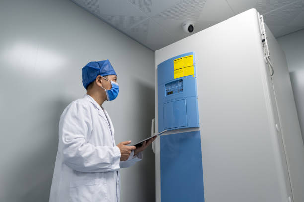 istock Low angle view of Asian male doctor holding tablet computer for work 1326811001