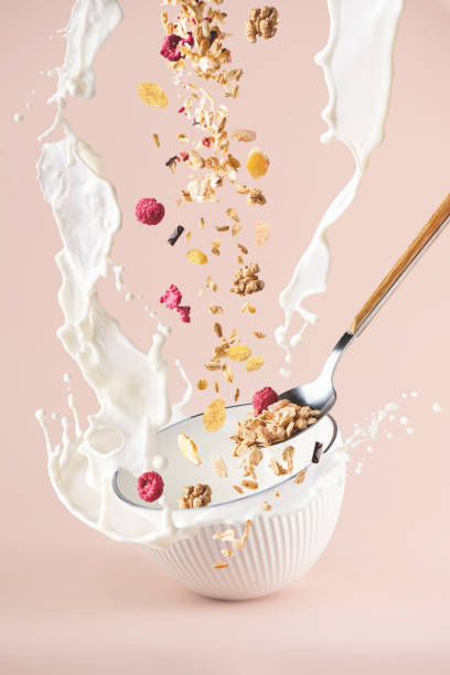 istock Oatmeal with milk, nuts and raspberry. Levitation. 1326812369