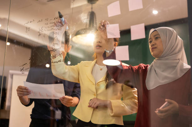 istock An Asian businesswoman presenting her ideas for company development 1326812583