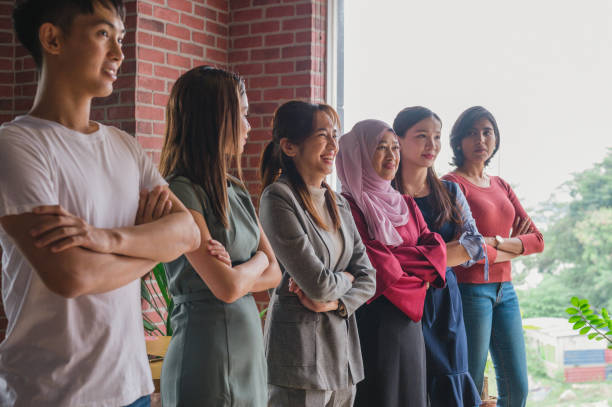 istock Successful multi-ethnic business team smiling teamwork in corporate office 1326812687