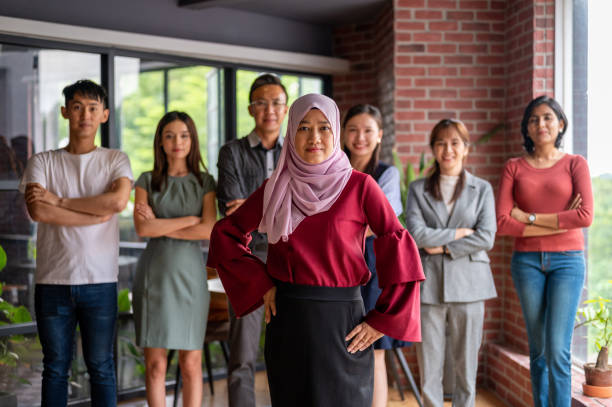istock Successful multi-ethnic business team smiling teamwork in corporate office 1326812757
