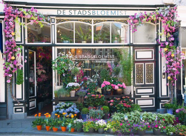 Zwolle, The Netherlands, June 2021: Front view lush floral facade city florist in the historic center of Zwolle, The Netherlands.