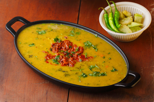Indian popular food Dal fry or traditional Dal Tadka Curry with Tandoori Roti