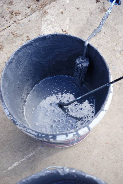 istock Mixing paint in a bucket with DIY 1326820649