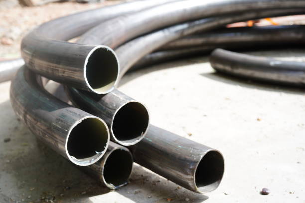 istock Curved steel pipes in construction site 1326820893