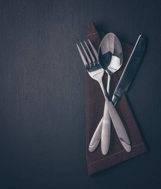 cutlery on black. knife fork and spoon. concept for a restaurant or menu top view, copy space. flat lay. - napkin black blank ideas imagens e fotografias de stock