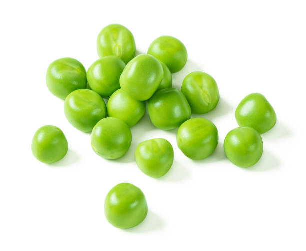 istock Green peas closeup isolated on white. Clipping path. 1326823063