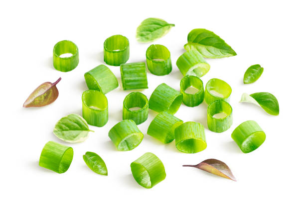 istock Chopped green onions and leaves isolated on white background 1326823173