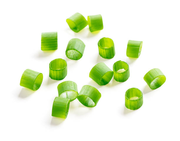 istock Chopped green onions isolated on white background 1326823208