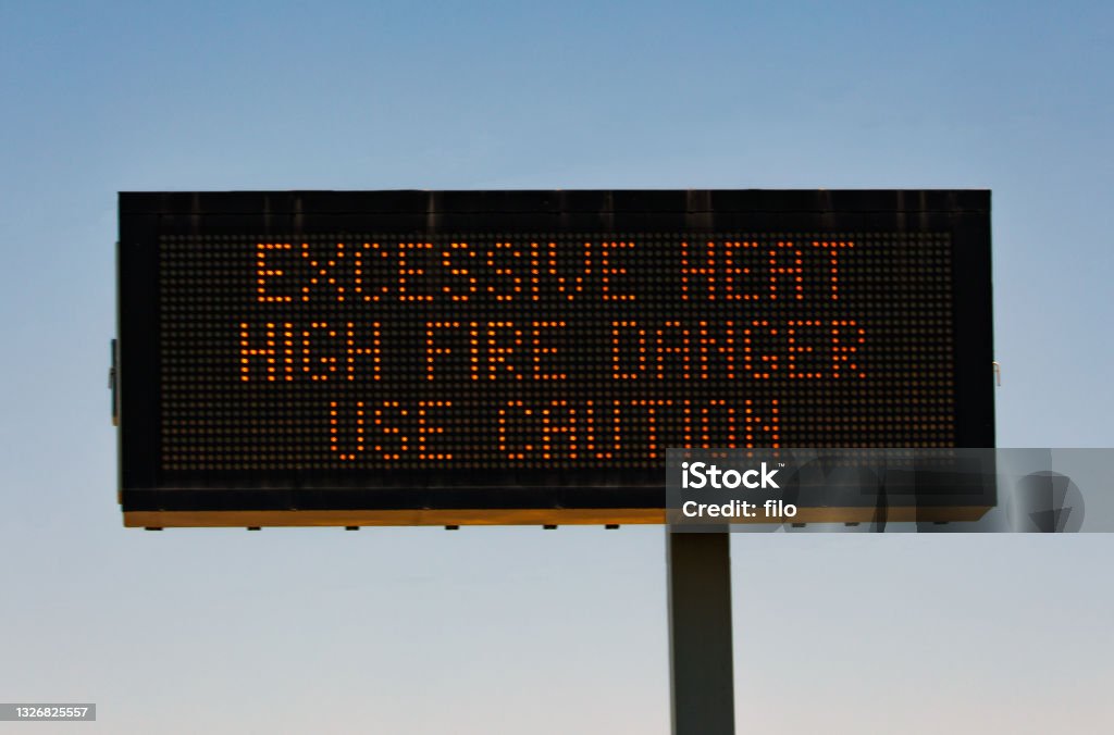 Excessive Heat Highway Warning Sign Excessive heat highway information warning sign. Heat Wave Stock Photo