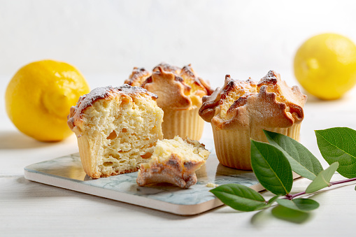 Soffioni - traditional ricotta cheese and lemon cakes. Concept of sweet and easter national pastries.