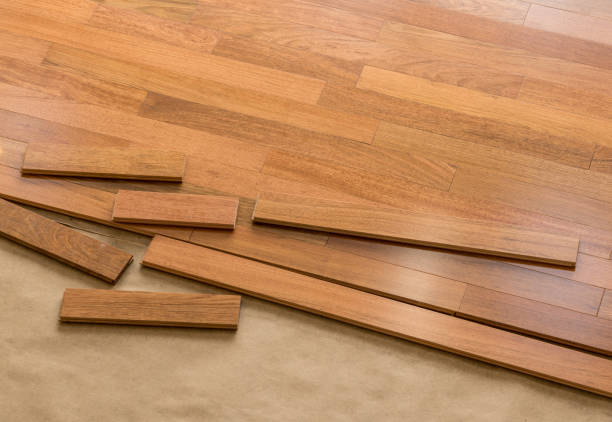 Installation of brazilian cherry hardwood flooring in room stock photo