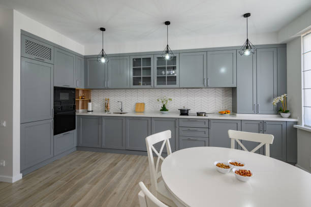 istock White round dining table and chairs for four at large kitchen 1326832746