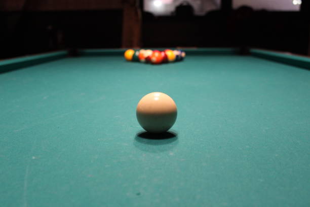 istock Billiard snooker pyramid on green table. American billiards pool on a green table 1326833810